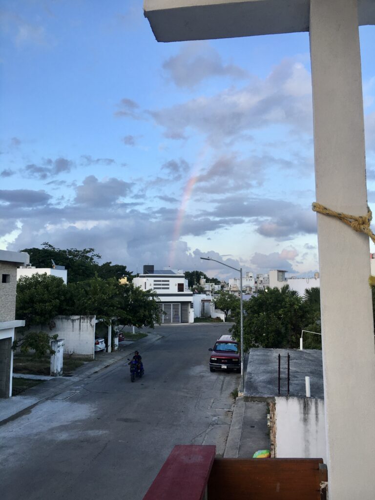 Actual footage of my Rappi order arriving on a motorcycle and a beautiful rainbow in the background.